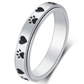 Silver pet lover ring with black paw prints and hearts, perfect for dog and cat owners