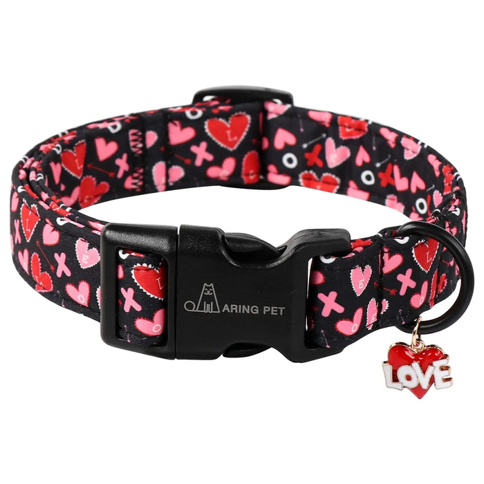 Black dog collar with red and pink hearts, XOXO pattern, and LOVE charm, ideal for Valentine's pet accessories.