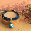 Blue patterned pet collar with lucky cat charm, perfect for cats and dogs