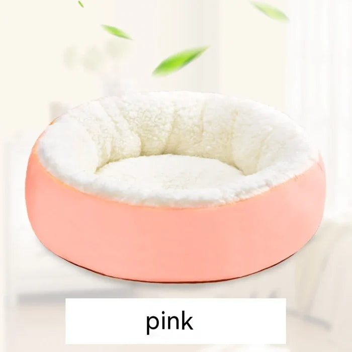 Pink plush pet bed with cozy white interior for dogs and cats