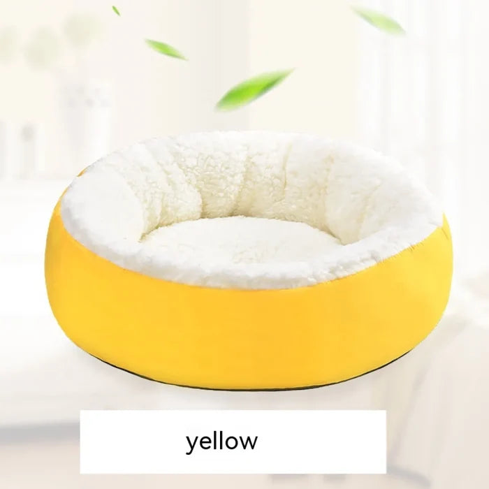 Yellow round pet bed with soft white fleece interior for dogs and cats