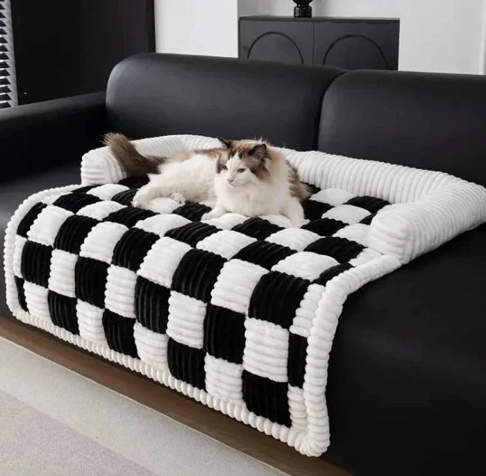 Fluffy cat resting on black and white checkered pet bed with corduroy texture, perfect for cozy pet lounging.