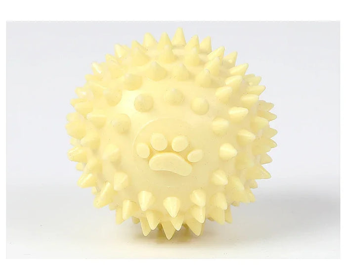 Yellow spiky dog chew toy with paw print design for pet play and dental care