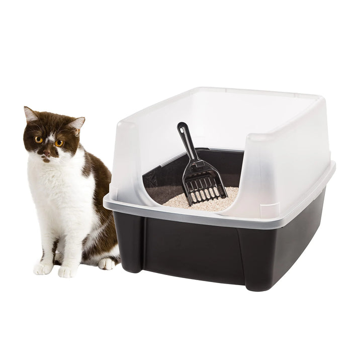 Cat beside covered litter box with scoop, ideal for pet care and hygiene