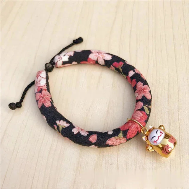 Floral pet collar with lucky cat charm, ideal for cats and small dogs