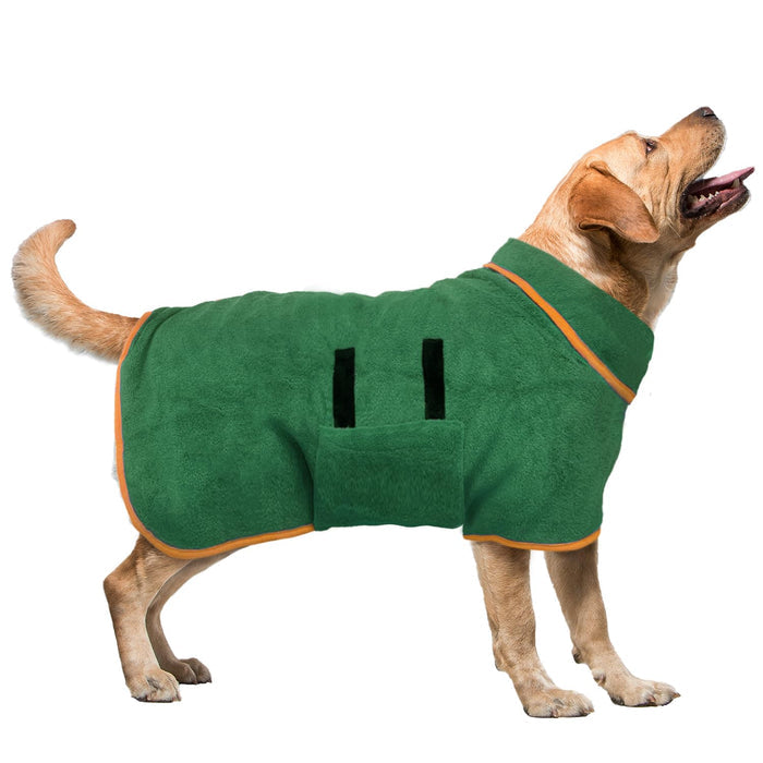 Yellow Labrador wearing a green fleece dog coat with orange trim.