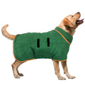 Yellow Labrador wearing a green fleece dog coat with orange trim.