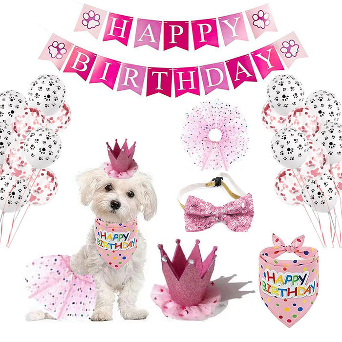 Pink birthday party supplies set for dogs including banners, balloons, crowns, and a bandana.