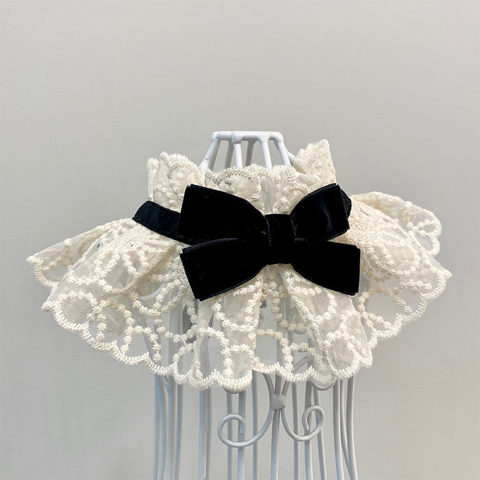 Elegant white lace pet collar with a black velvet bow for dogs and cats.