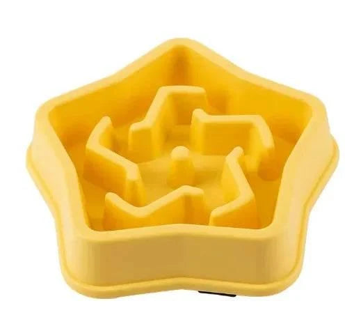 Yellow star-shaped slow feeder bowl for dogs and cats, promoting healthy eating habits.