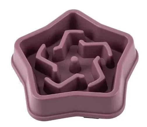 Purple star-shaped slow feeder bowl for dogs and cats, promoting healthy eating habits with maze design.