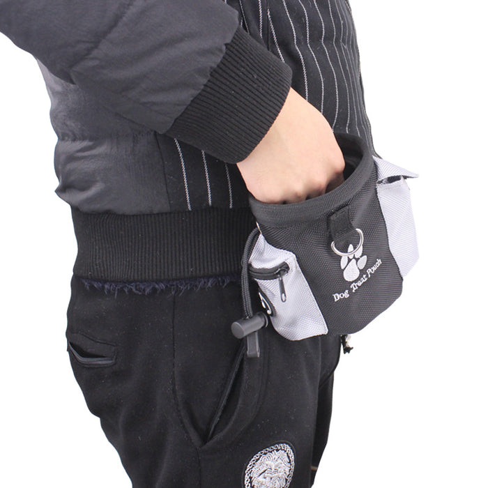 Black dog treat pouch with paw print, worn on waist for easy access during training or walks.