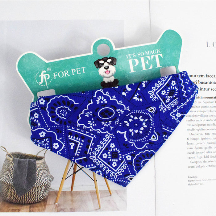 Blue paisley pattern dog bandana accessory for pets on a decorative display card