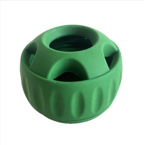 Green rubber dog puzzle toy for mental stimulation and treat dispensing