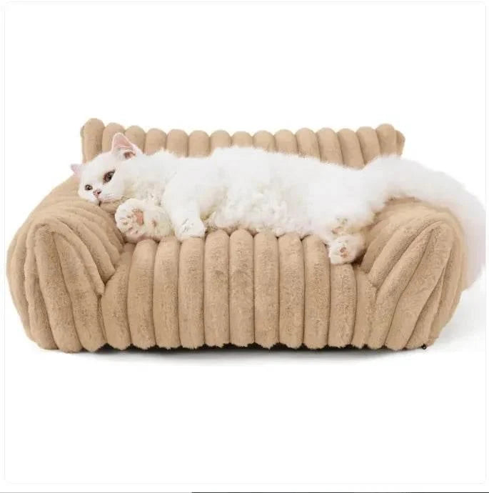 Fluffy white cat lounging on cozy beige pet bed, perfect for cat comfort and relaxation.
