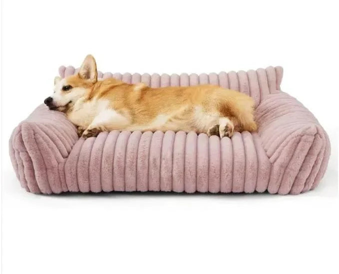 Cozy pink corduroy dog bed with a relaxed corgi resting comfortably