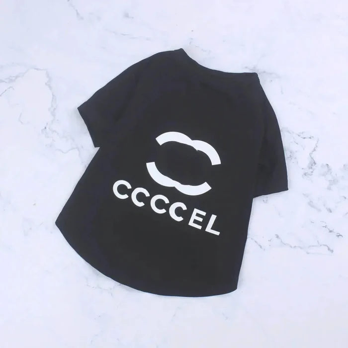 Black pet t-shirt with white CCCCCEL logo on marble background, stylish dog or cat apparel
