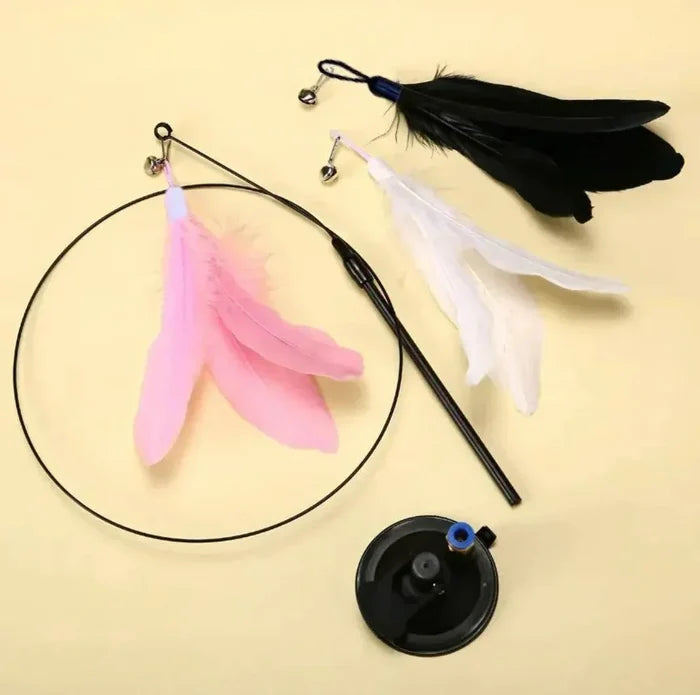 Cat feather wand toy with pink, white, and black feathers for interactive play