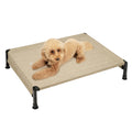 Cozy dog resting on elevated pet bed with breathable fabric and sturdy black legs, ideal for small dogs